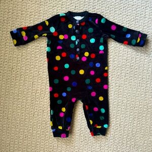 Hanna Andersson Velvet snap closure pajamas with colorful polka dots.